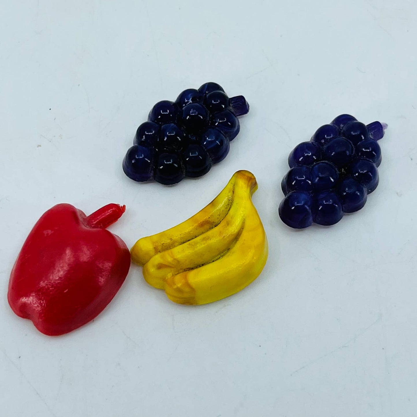 Vintage Lot of 4 Miniature Celluloid Fruit Grapes Banana Apple Magnets 1” SB1