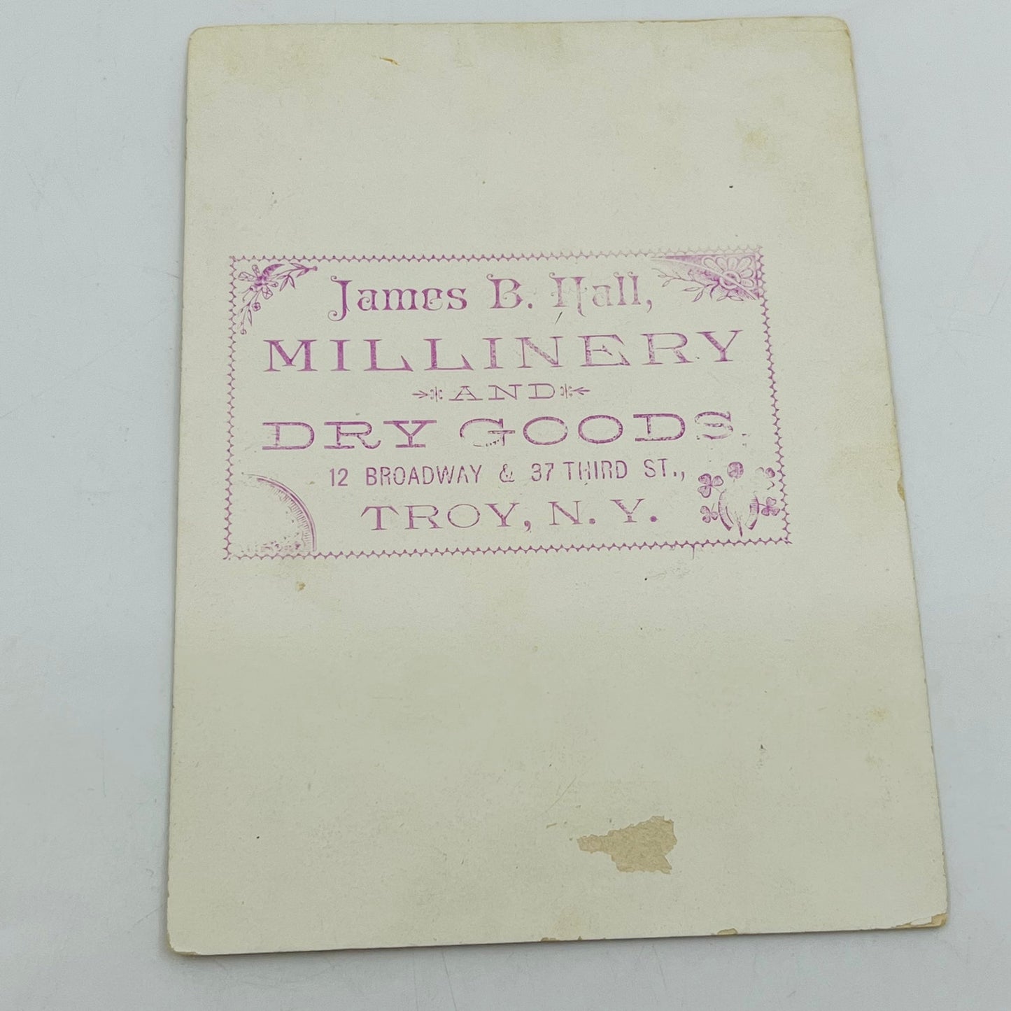Victorian 1800s Trade Card Magnolia Cherub James B Hall Millinery Troy NY SAH9-2
