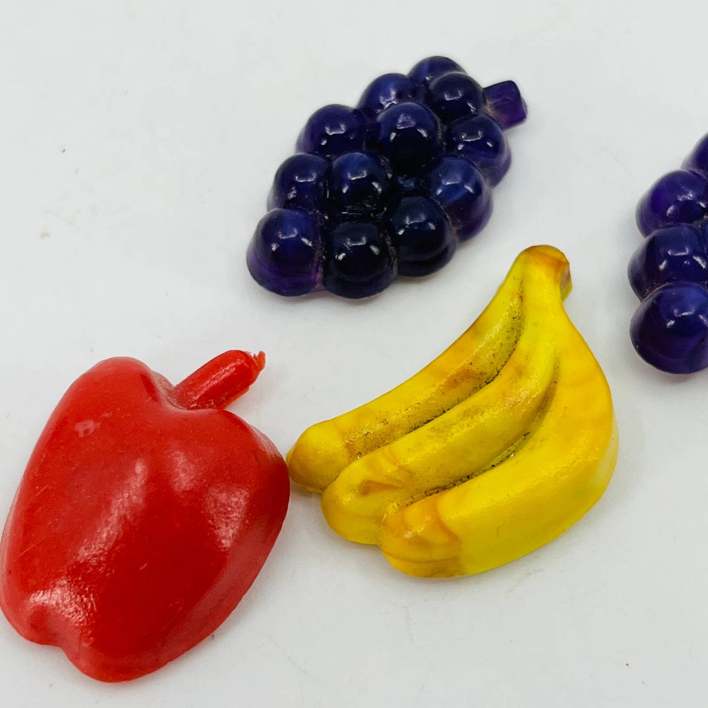 Vintage Lot of 4 Miniature Celluloid Fruit Grapes Banana Apple Magnets 1” SB1
