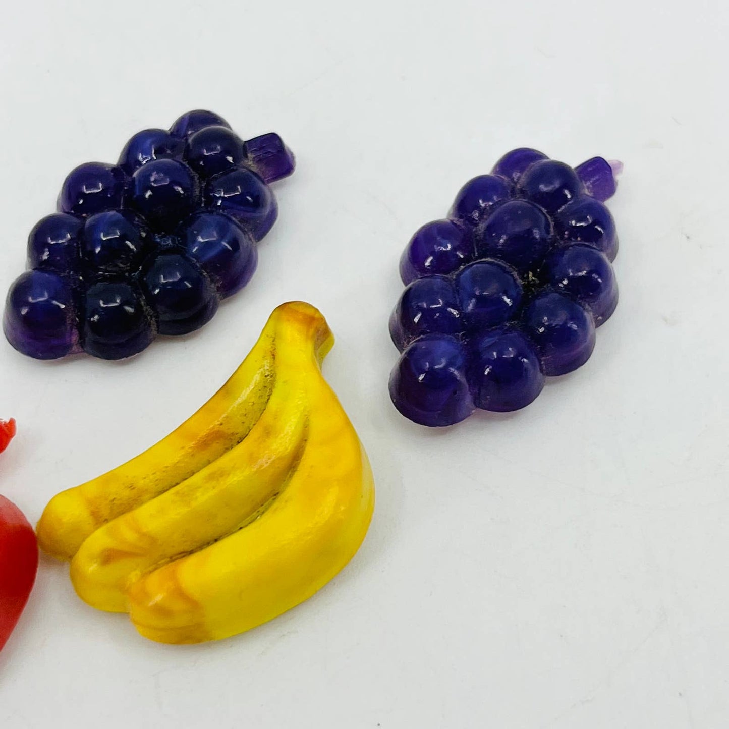 Vintage Lot of 4 Miniature Celluloid Fruit Grapes Banana Apple Magnets 1” SB1