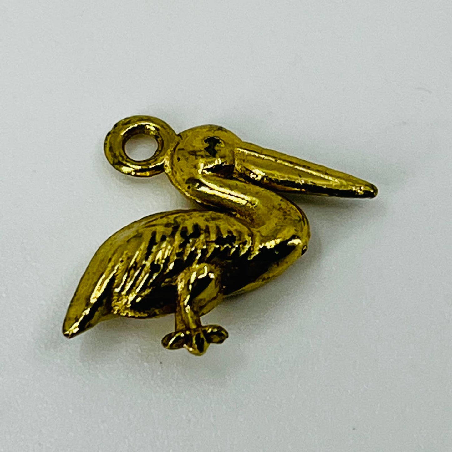 Vintage Gold Tone Celluloid Stork Bird Charm SB3