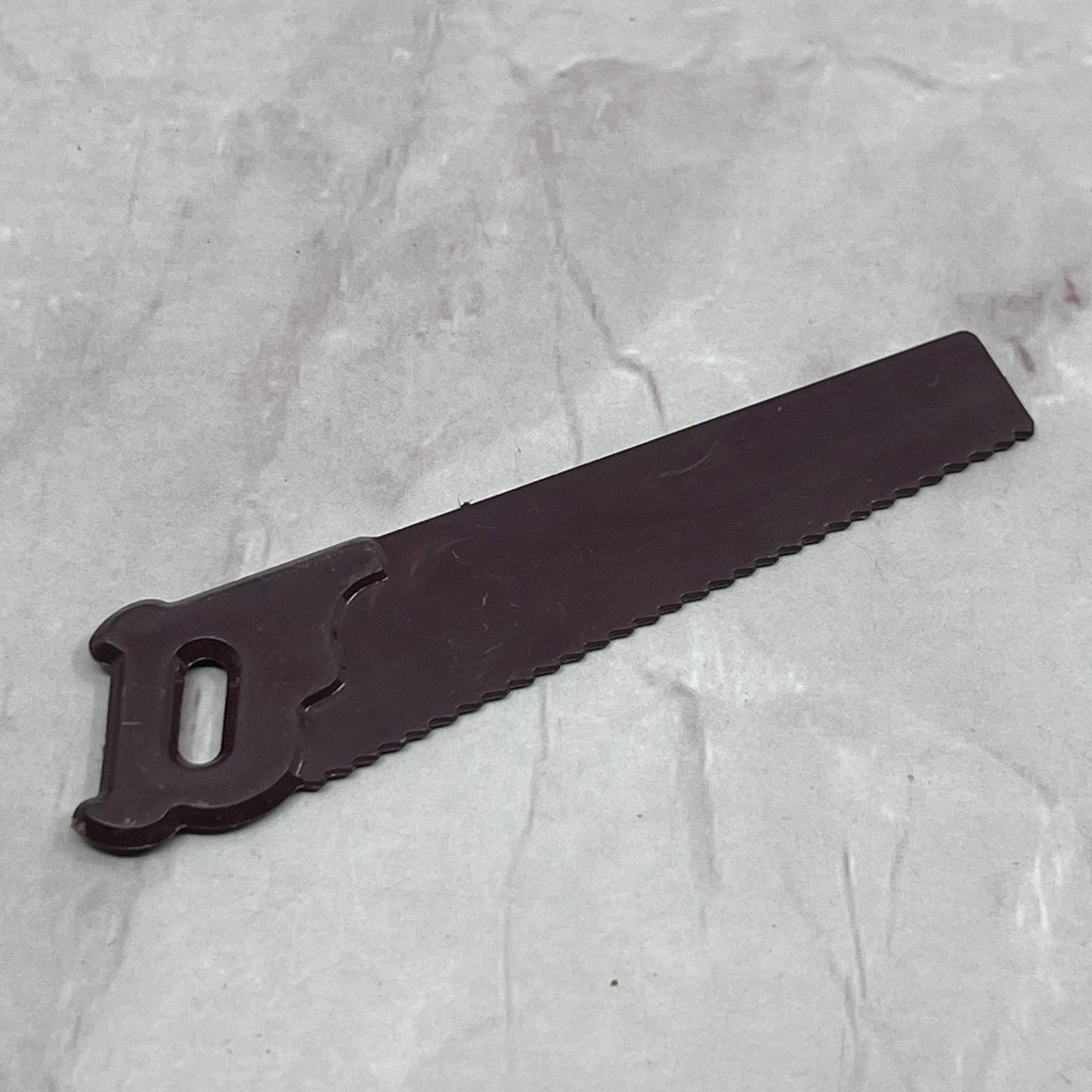 Vintage Red Maroon Cranberry Celluloid 2.5" Toy Saw Accessory SB7