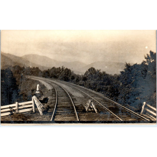 Curved Railroad Tracks Near a Mountain Range RPPC Real Photo Postcard AB9