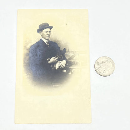 1912 RPPC Man Holding Patterdale Terrier Dog Harry Mitchell Olathe KS AC2