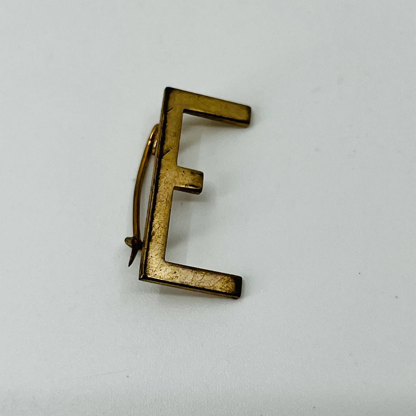 Vintage “E” Pin Gold Tone Pinback Lapel Hat SB3
