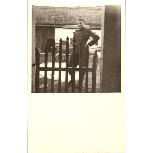 Antique Postcard RPPC WWI German Soldier Posing Next to Fence SE8
