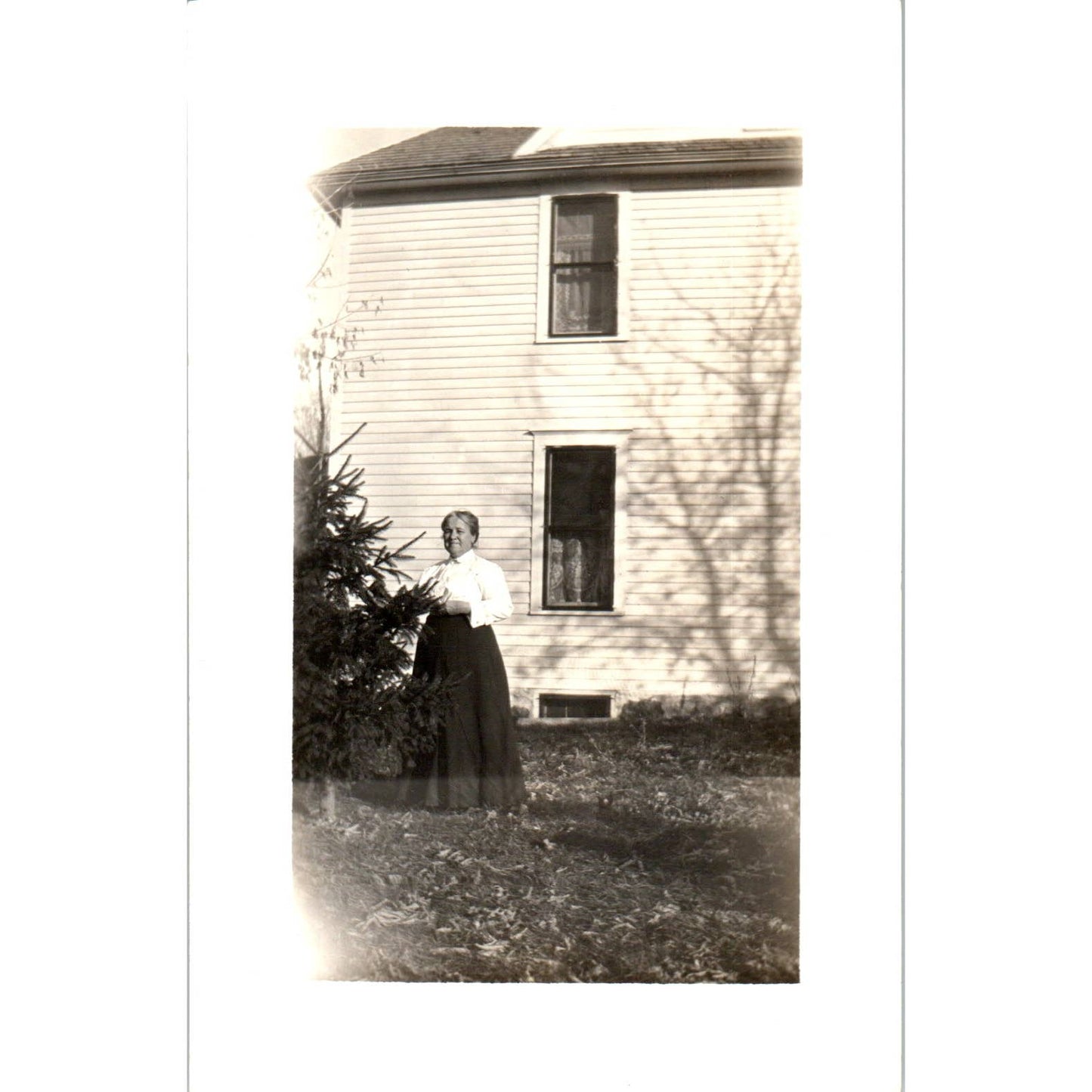 Antique RPPC Postcard Woman in Black Skirt Standing Outside Farmhouse EA3