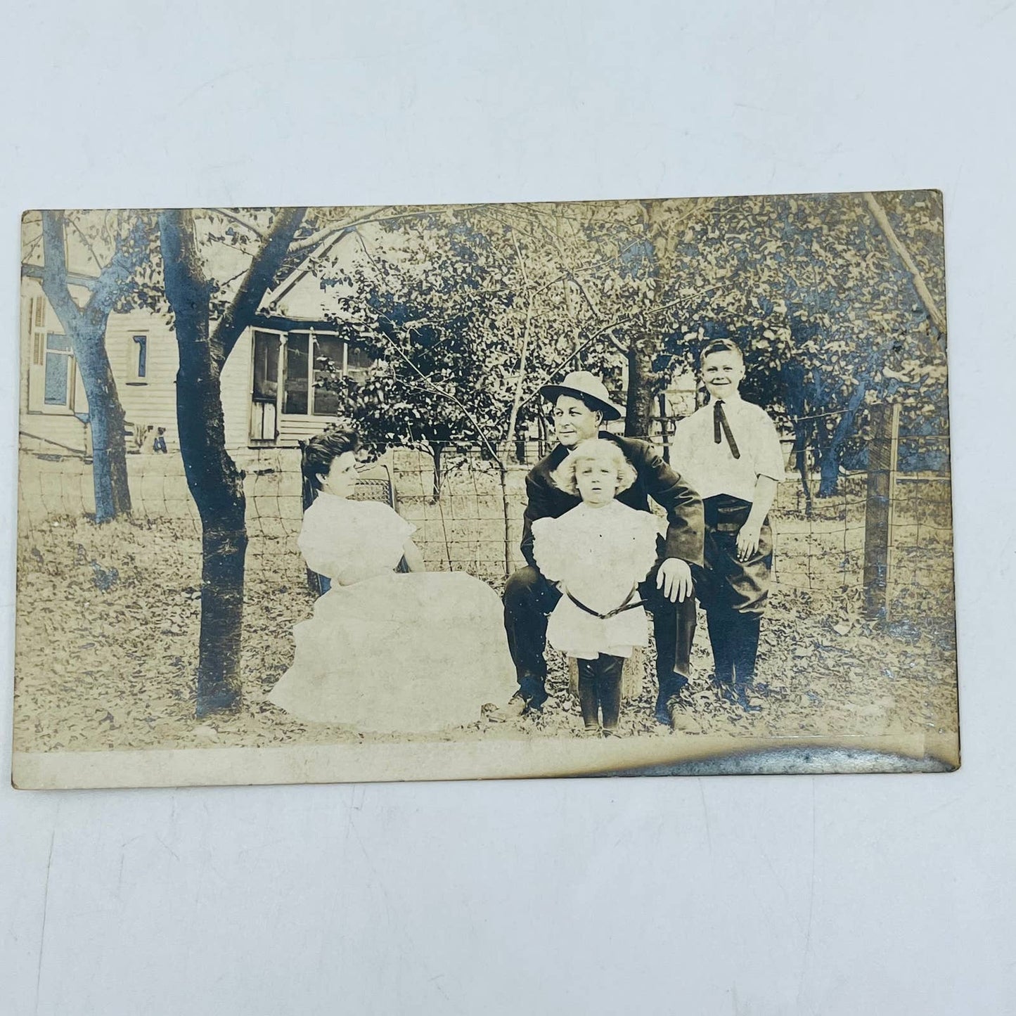 Early 1900s RPPC Portrait Family Poses Outside Farmhouse PA9