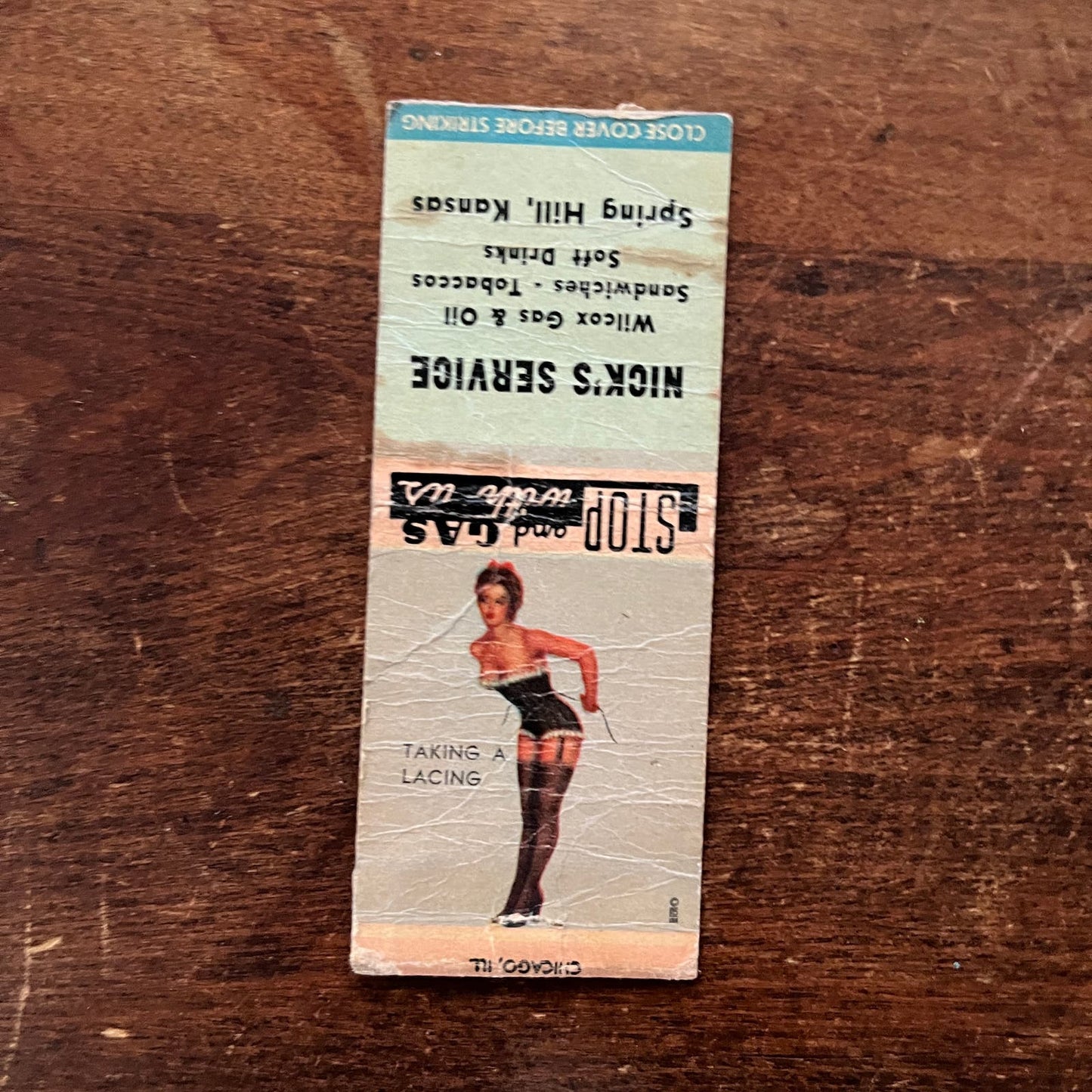 Nick's Service Spring Hill PINUP Taking a Lacing Advertising Matchbook SA9-M12