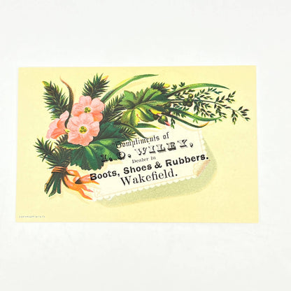 1880s Victorian Trade Card I.O. Wiley Boots & Shoes Wakefield MA Pink Flower AB6