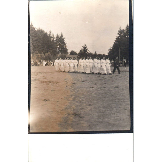 Antique Postcard RPPC Group of Nurses in White Following a Soldier SE8