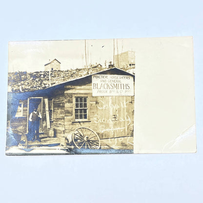 1907 RPPC Proux Bros. & Co. props Horseshoes & Blacksmiths Cobalt Sunday AC1