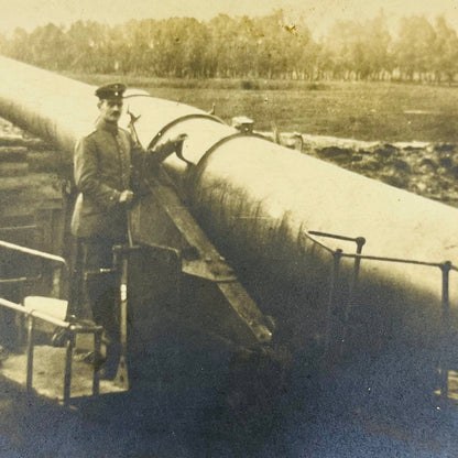 Early 1900s RPPC WWI Soldier Posing Next To Giant Artillery Canon PA9