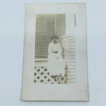 Early 1900s RPPC Portrait Young Lady On Porch White Dress Short Hair PA9