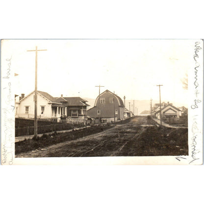 Antique Postcard RPPC Railroad Tracks Running Through City Near Barn c1910 SE8
