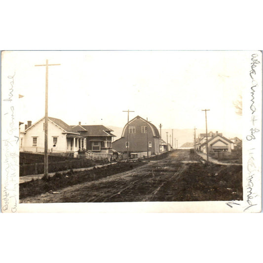 Antique Postcard RPPC Railroad Tracks Running Through City Near Barn c1910 SE8