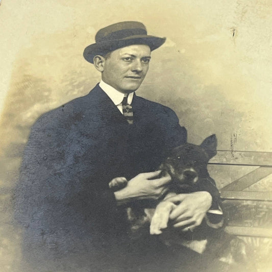 1912 RPPC Man Holding Patterdale Terrier Dog Harry Mitchell Olathe KS AC2
