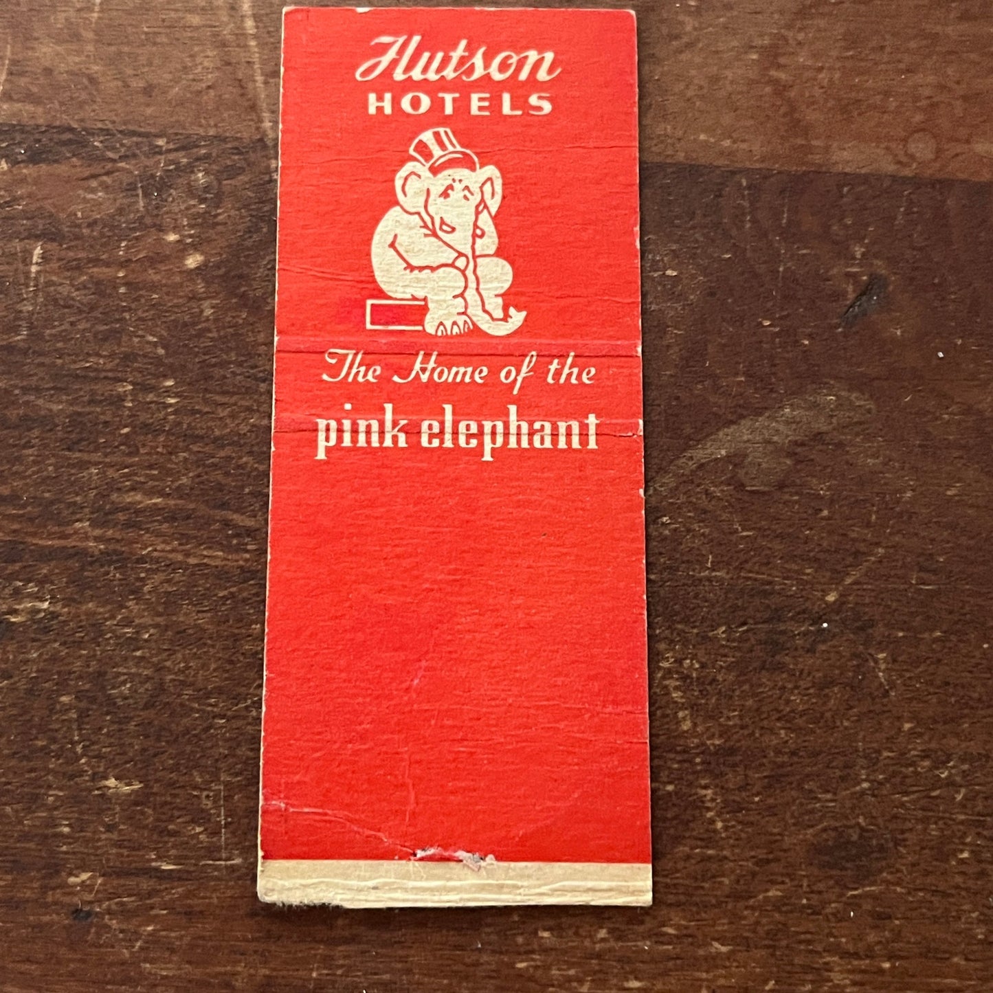 Hutson Hotels W.G. Hutson Pink Elephant Advertising Matchbook Cover MM9-3