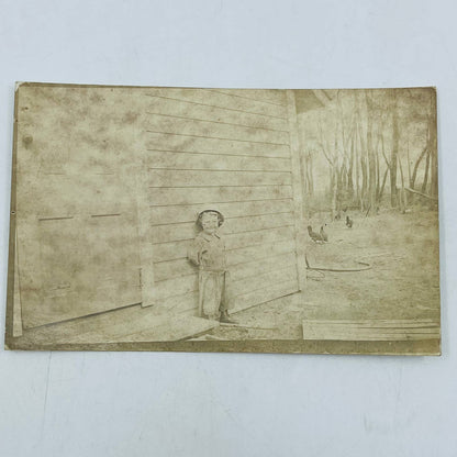 Early 1900s RPPC Portrait Young Child Poses Outside Farmhouse With Chickens PA9