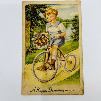 1910s Birthday Post Card Blue Boy Riding Tricycle Bouquet Flowers PA5