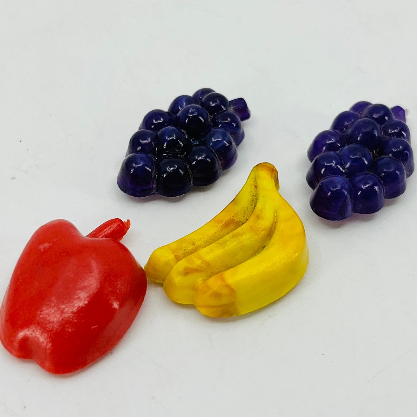 Vintage Lot of 4 Miniature Celluloid Fruit Grapes Banana Apple Magnets 1” SB2