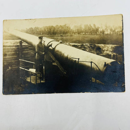 Early 1900s RPPC WWI Soldier Posing Next To Giant Artillery Canon PA9