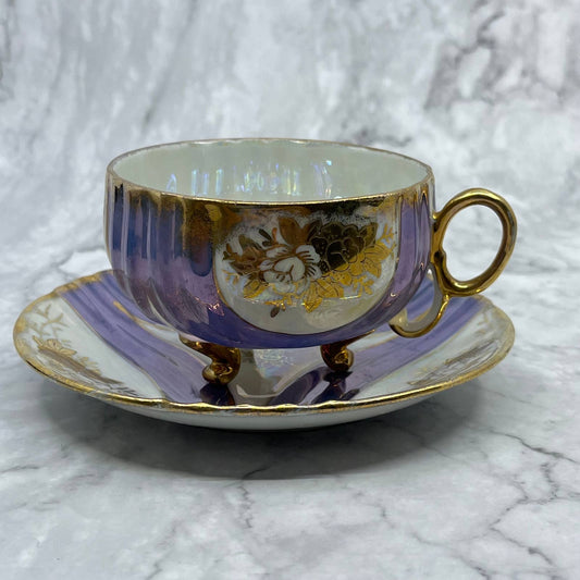Footed Teacup & Saucer Iridescent Gold Flowers & Trim Purple/Blue Accents TA7
