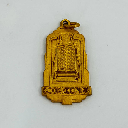 Vintage BOOKKEEPING Gold Tone Pendant Charm SB9