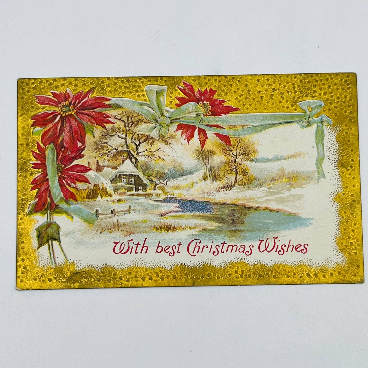 1910s Christmas Post Card Embossed Cottage Ribbon Poinsettias Snow Dresden PA4