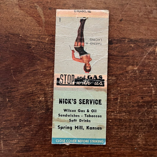 Nick's Service Spring Hill PINUP Taking a Lacing Advertising Matchbook SA9-M12